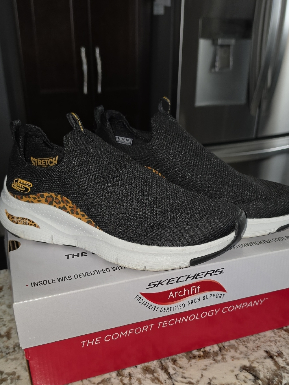Skechers Black Slip-On Sneakers with Leopard Accent